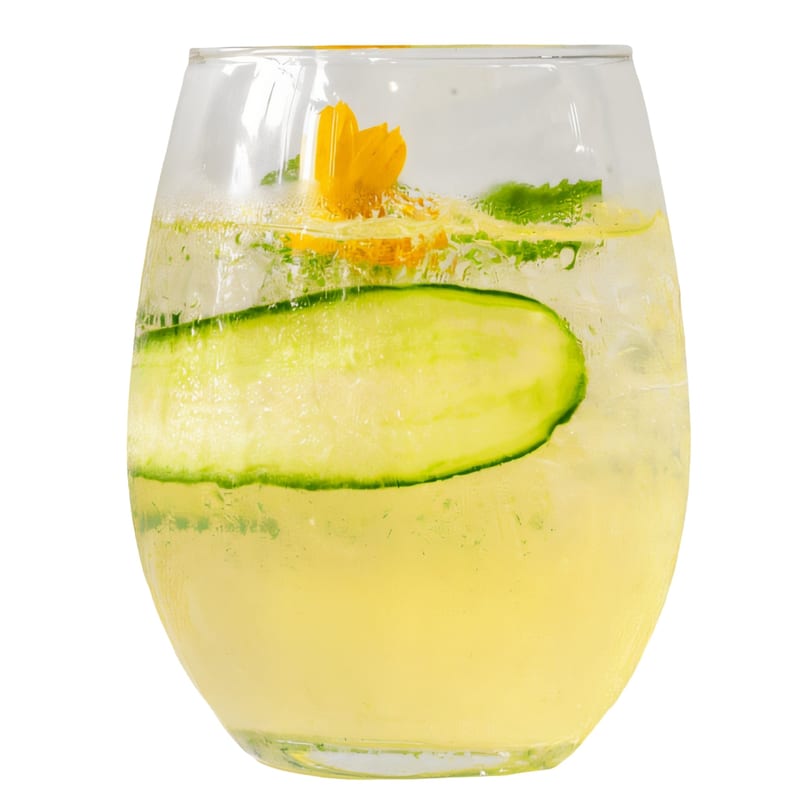 Pelican Restaurant's refreshing cocktail with cucumber, mint, and a yellow flower garnish.